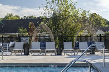 A pool with a warning sign for no lifeguard.